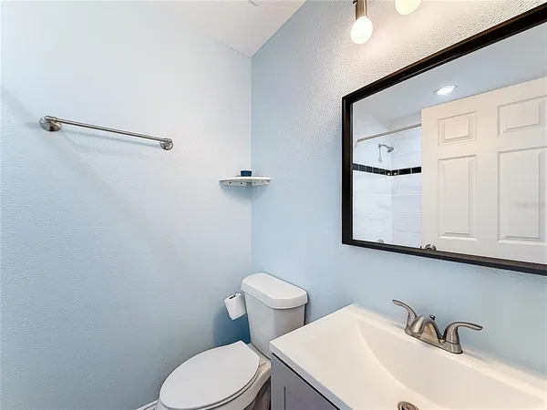 a bathroom with a shower and a shower