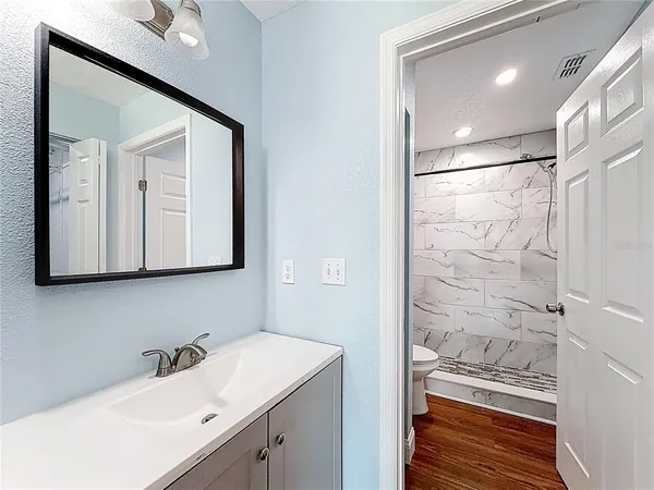 a bathroom with a shower and toilet
