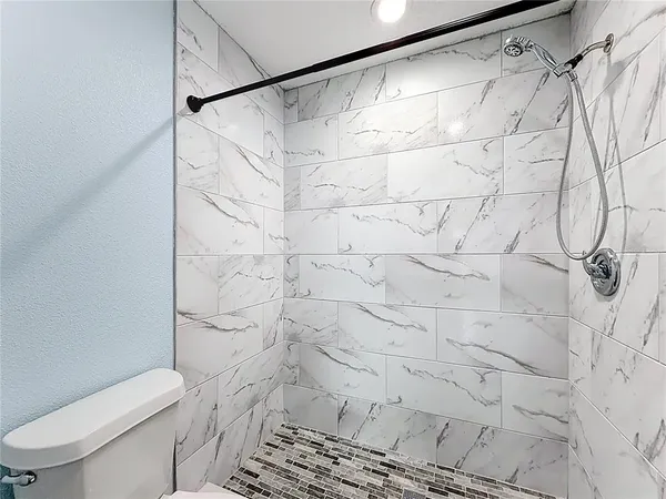a bathroom with a sink vanity and a mirror