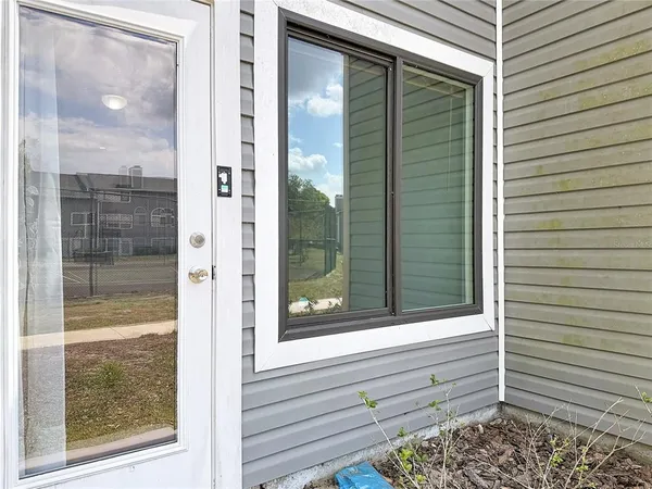 a view of an ocean with a house and a big yard