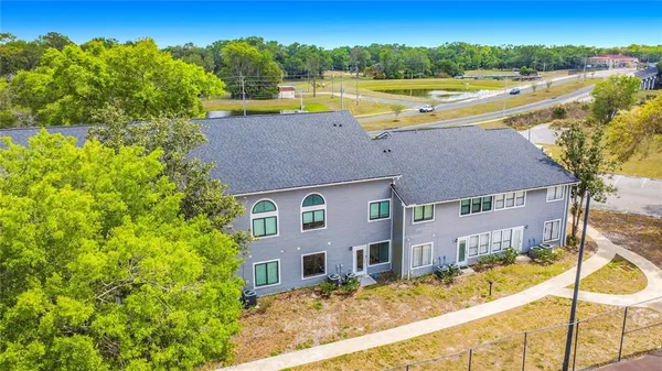 a view of a swimming pool with a patio