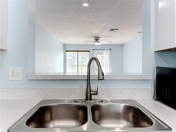 a kitchen with a stove cabinets and a refrigerator