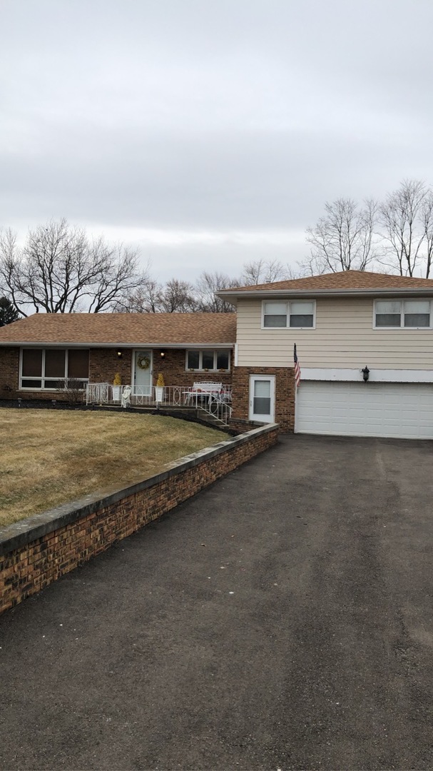 1940 Jericho Road Aurora, IL 60506 - Photo 2 of 29 an aerial view of a house with a garden