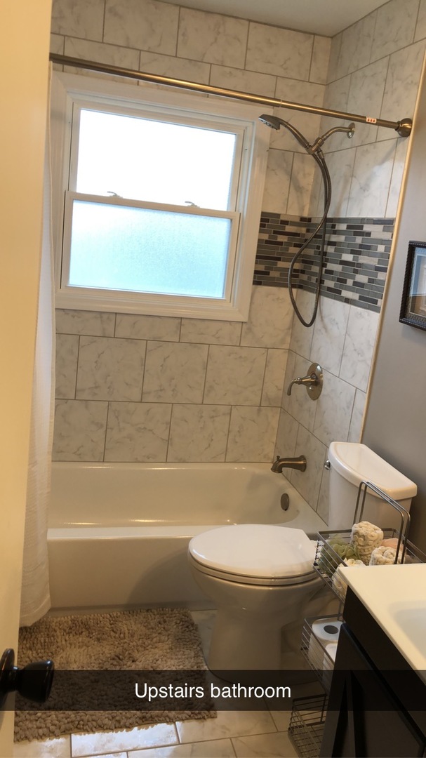 1940 Jericho Road Aurora, IL 60506 - Photo 14 of 29 a bathroom with a sink a toilet and shower