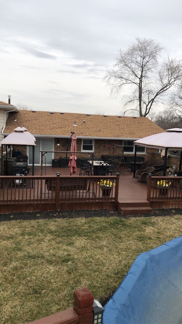 1940 Jericho Road Aurora, IL 60506 - Photo 26 of 29 a view of a swimming pool with lawn chairs under an umbrella