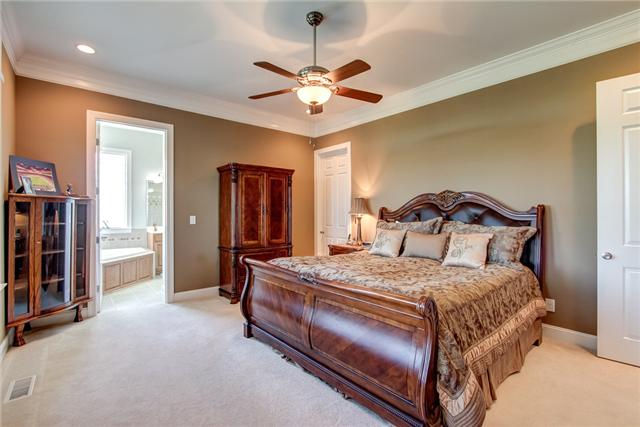 7229 Anderson Road Fairview, TN 37062 - Photo 11 of 20 Master bedroom is a wonderful retreat with large closet and a whirlpool bath and gorgeous views from a wall of windows.