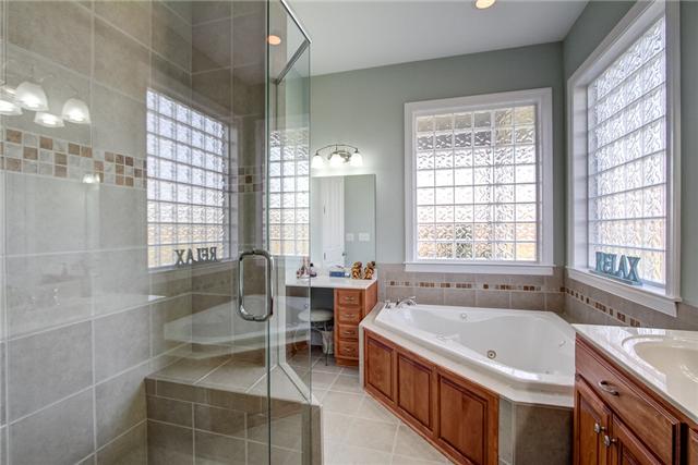 7229 Anderson Road Fairview, TN 37062 - Photo 12 of 20 Master bath has large shower, corner whirlpool tub and separate vanities