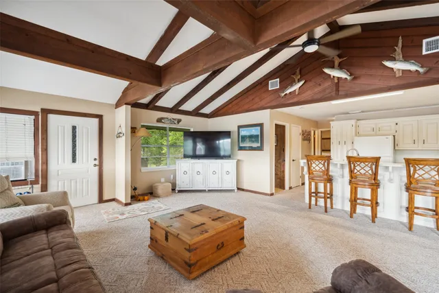 a view of a lake with houses in the background