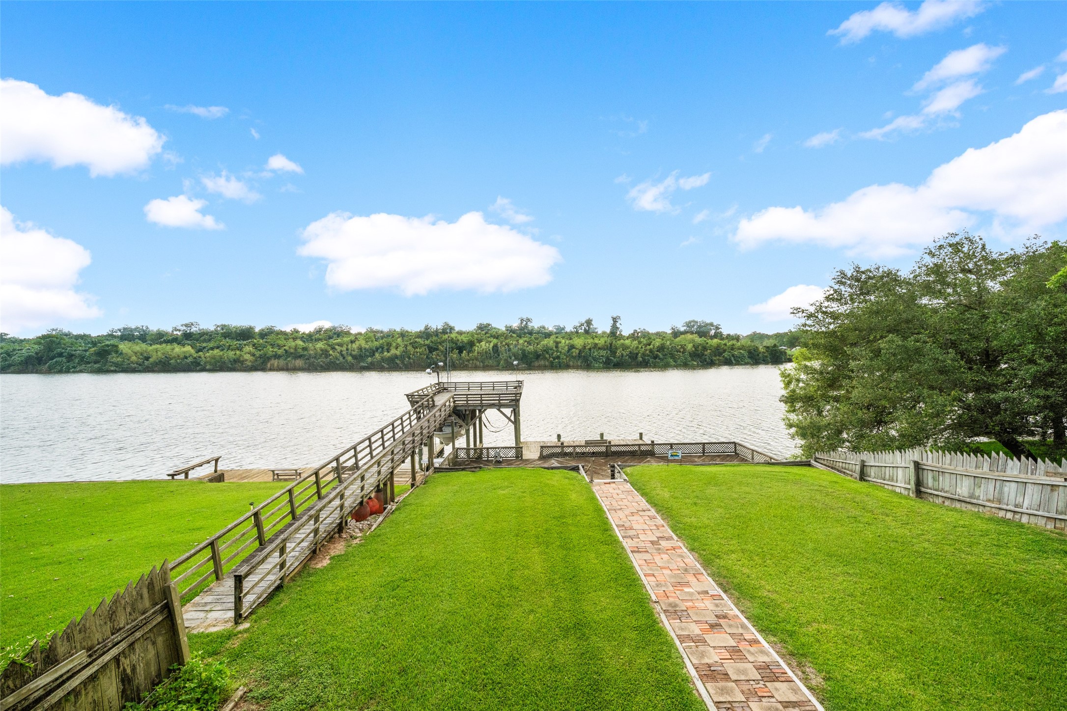 215 Selkirk Road Bay City, TX 77414 - Photo 13 of 36 a view of a lake with houses in the background