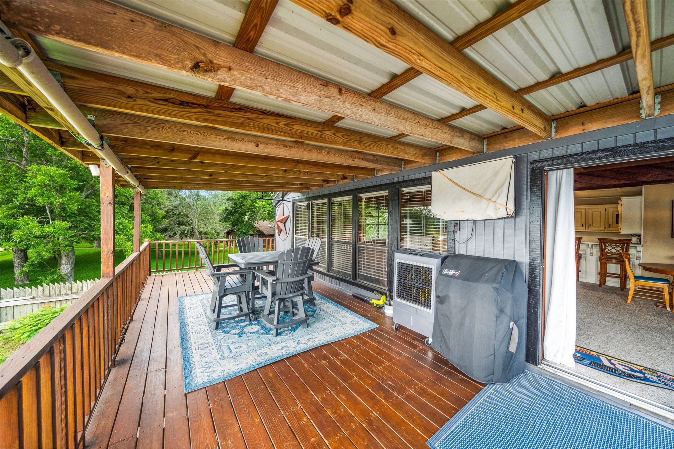 215 Selkirk Road Bay City, TX 77414 - Photo 14 of 36 a patio with wooden floors and outdoor seating