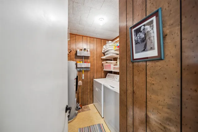 a view of a kitchen with furniture and appliances