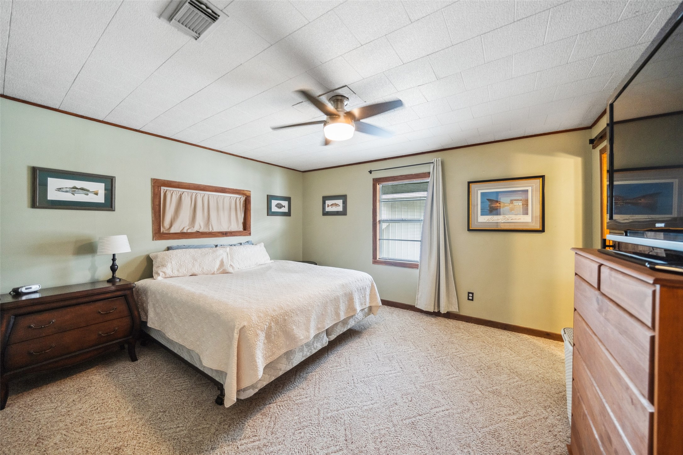 215 Selkirk Road Bay City, TX 77414 - Photo 19 of 36 a bedroom with a bed and a flat screen tv