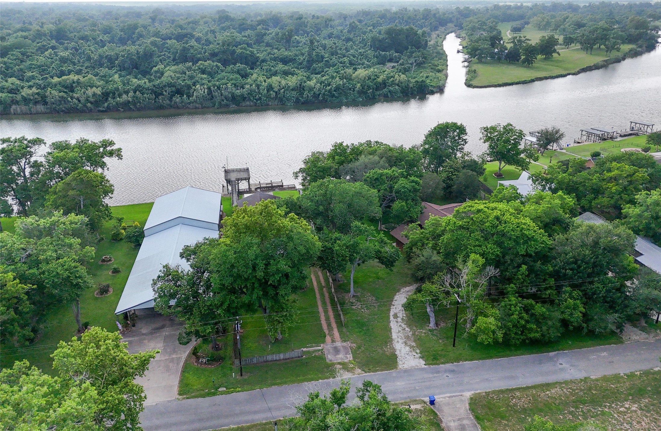 215 Selkirk Road Bay City, TX 77414 - Photo 23 of 36 an aerial view of a house with a yard and lake view