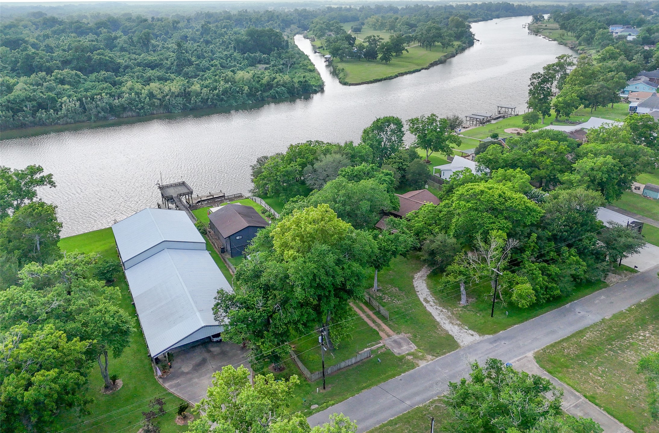 215 Selkirk Road Bay City, TX 77414 - Photo 24 of 36 an aerial view of a house with a yard and lake view