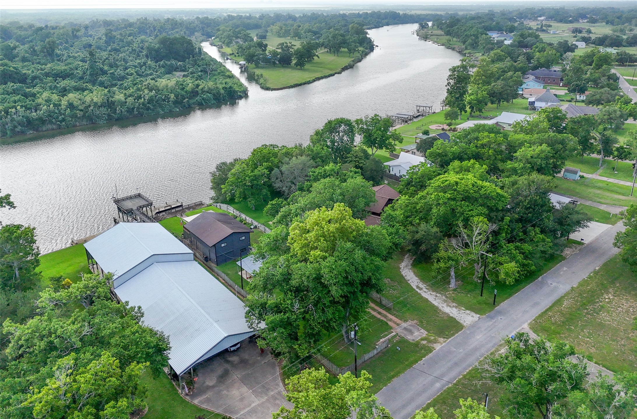 215 Selkirk Road Bay City, TX 77414 - Photo 25 of 36 an aerial view of a house with a yard and lake view