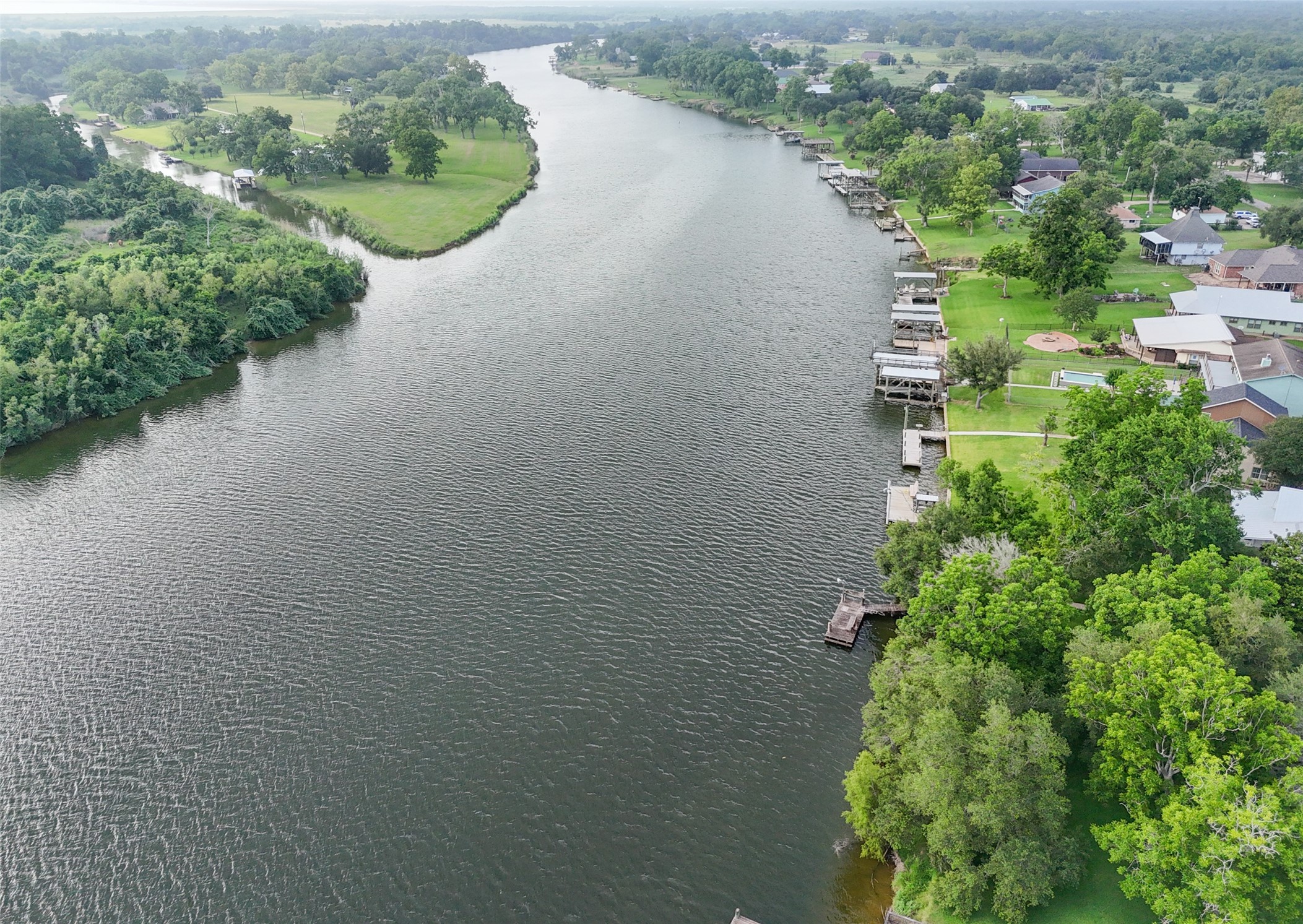 215 Selkirk Road Bay City, TX 77414 - Photo 27 of 36 an aerial view of a house with a yard and lake view