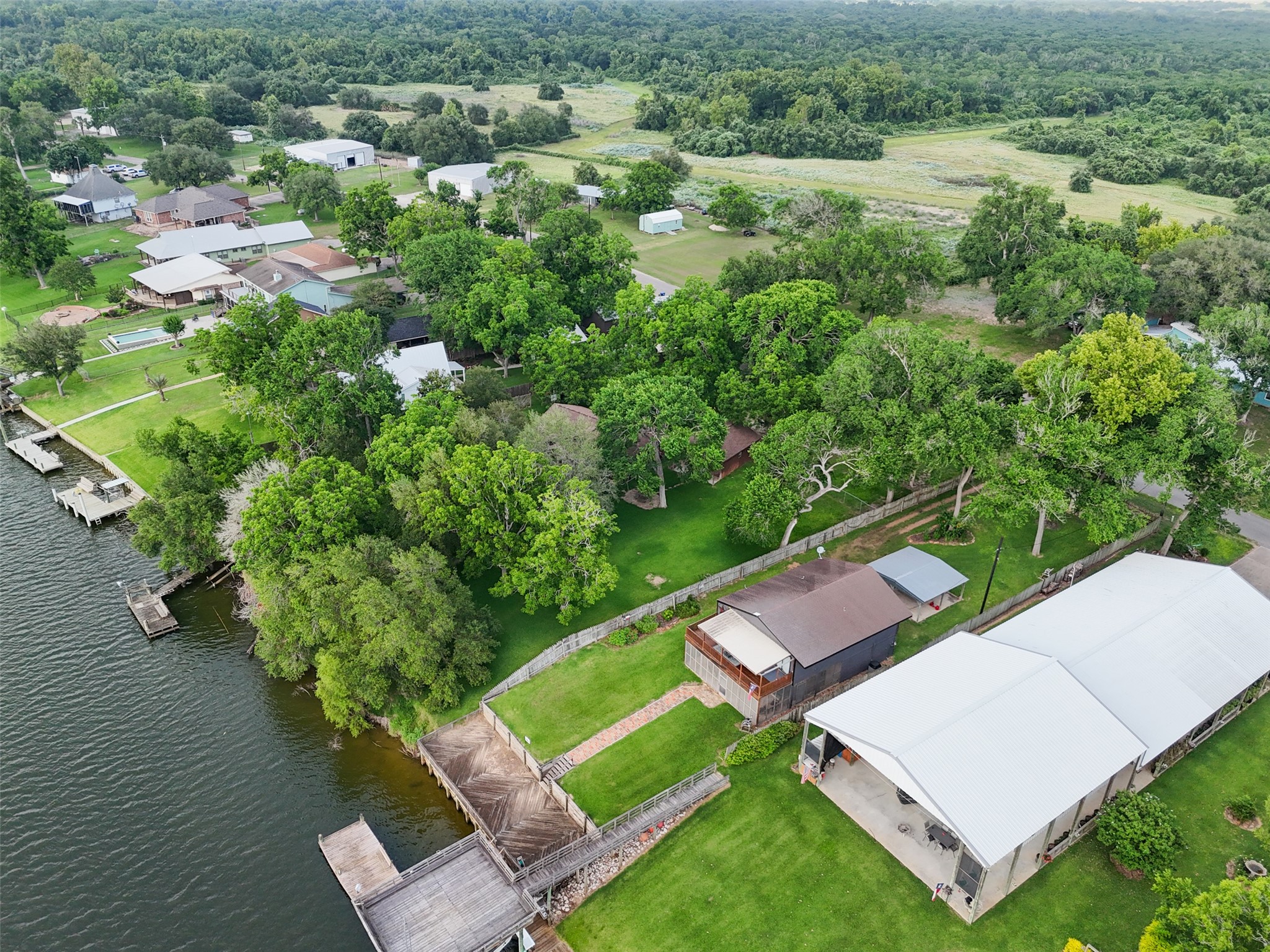 215 Selkirk Road Bay City, TX 77414 - Photo 28 of 36 an aerial view of a house with a yard and lake view