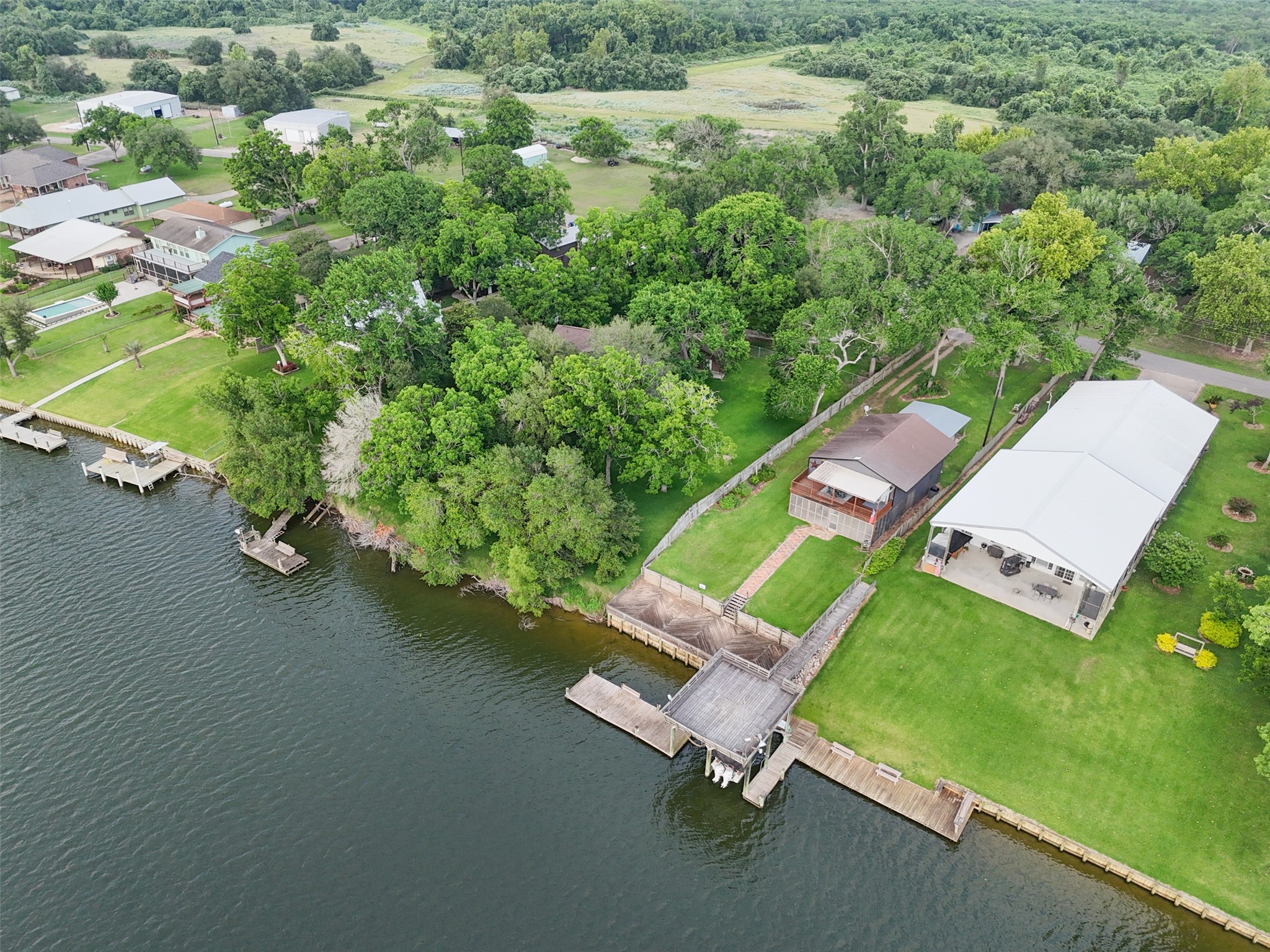 215 Selkirk Road Bay City, TX 77414 - Photo 30 of 36 an aerial view of a house with a yard and lake view