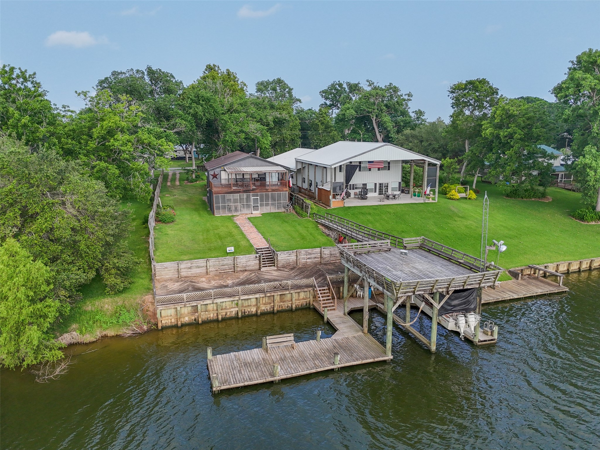 215 Selkirk Road Bay City, TX 77414 - Photo 34 of 36 an aerial view of a house with swimming pool patio and lake view