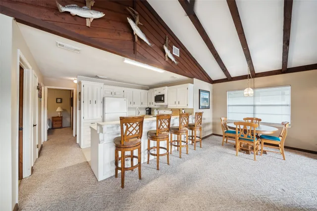 a view of a chairs and table in a room