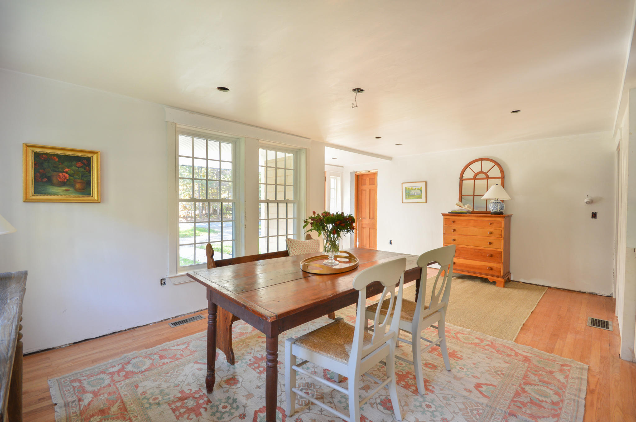 140 Scraggy Neck Road Cataumet, MA 02534 - Photo 14 of 39 a view of a dining room with furniture and wooden floor