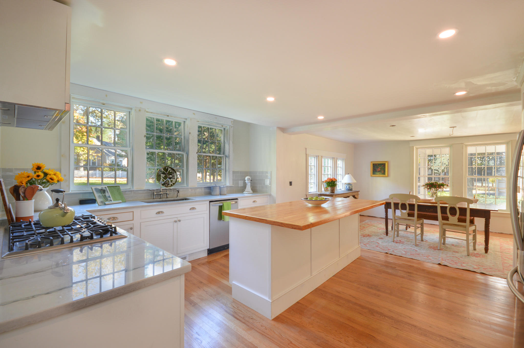 140 Scraggy Neck Road Cataumet, MA 02534 - Photo 17 of 39 a large kitchen with lots of counter and chairs
