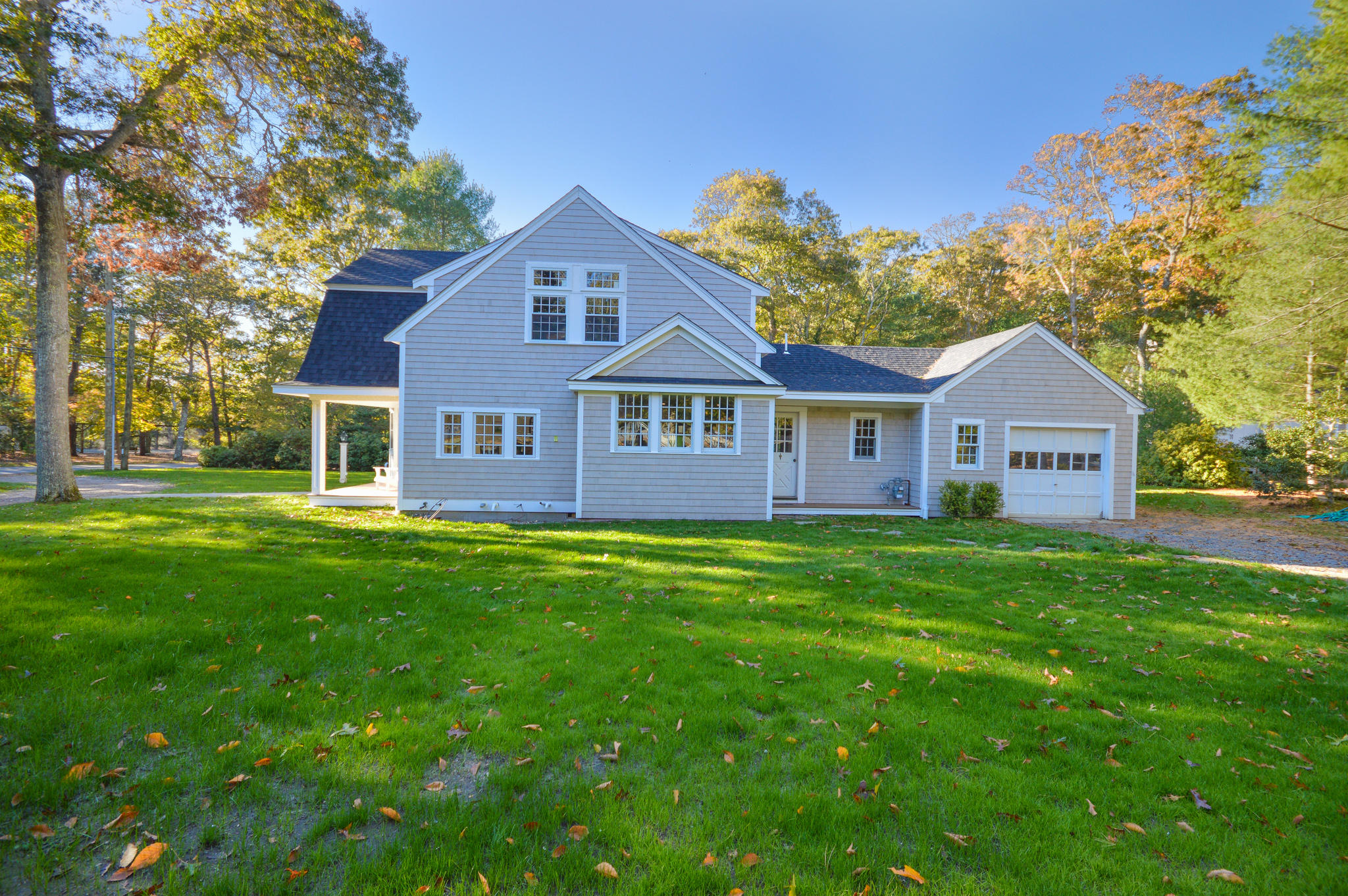 140 Scraggy Neck Road Cataumet, MA 02534 - Photo 28 of 39 a view of a house with a big yard and large trees