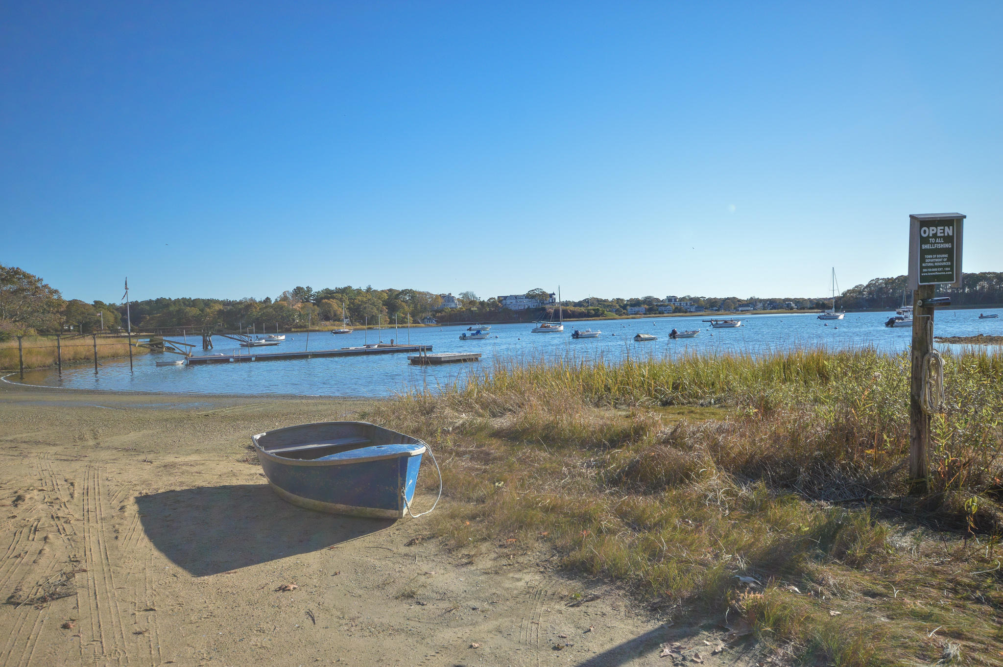 140 Scraggy Neck Road Cataumet, MA 02534 - Photo 37 of 39 a view of a lake with couches in front of house