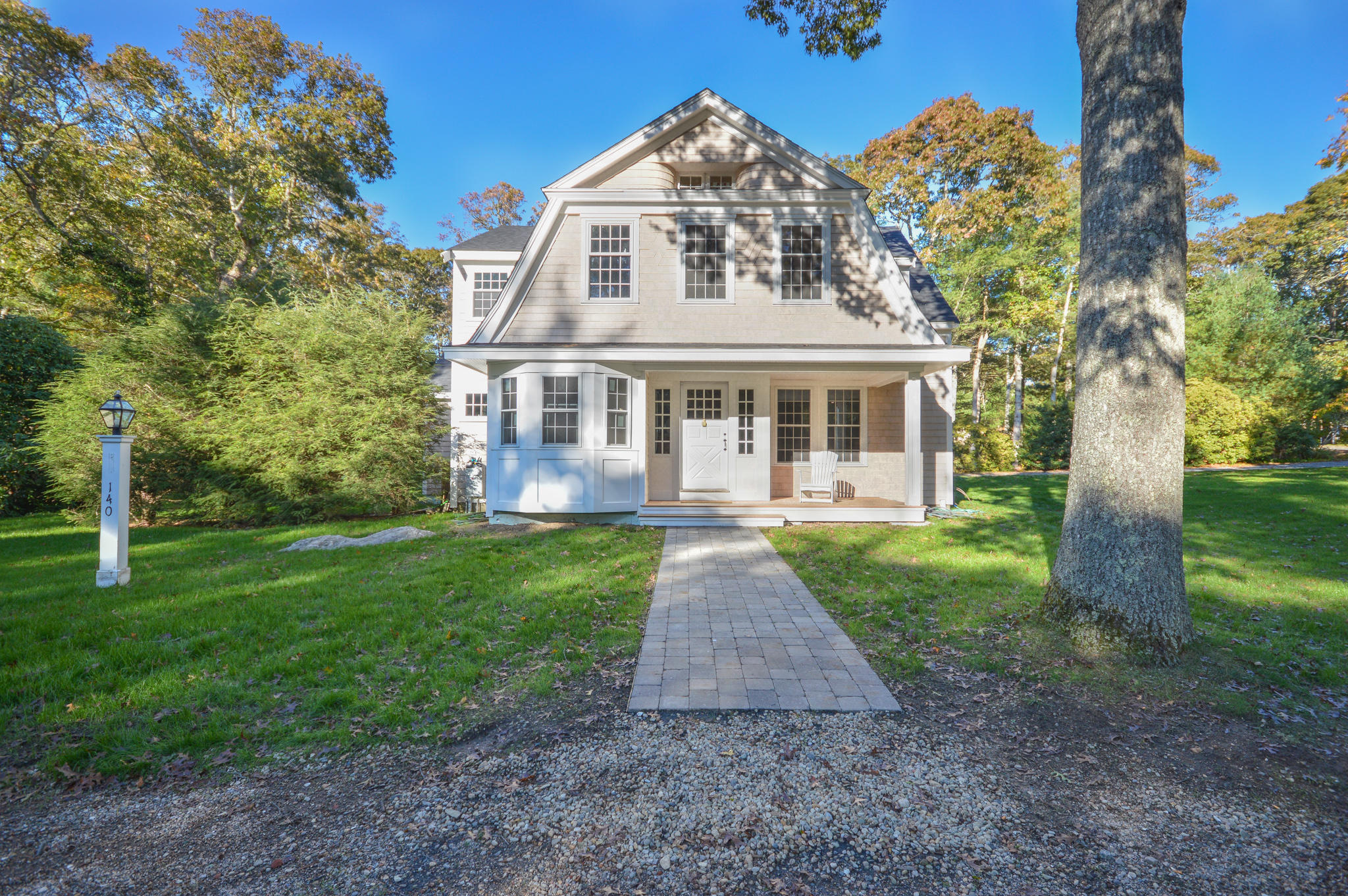140 Scraggy Neck Road Cataumet, MA 02534 - Photo 8 of 39 front view of a house with a yard