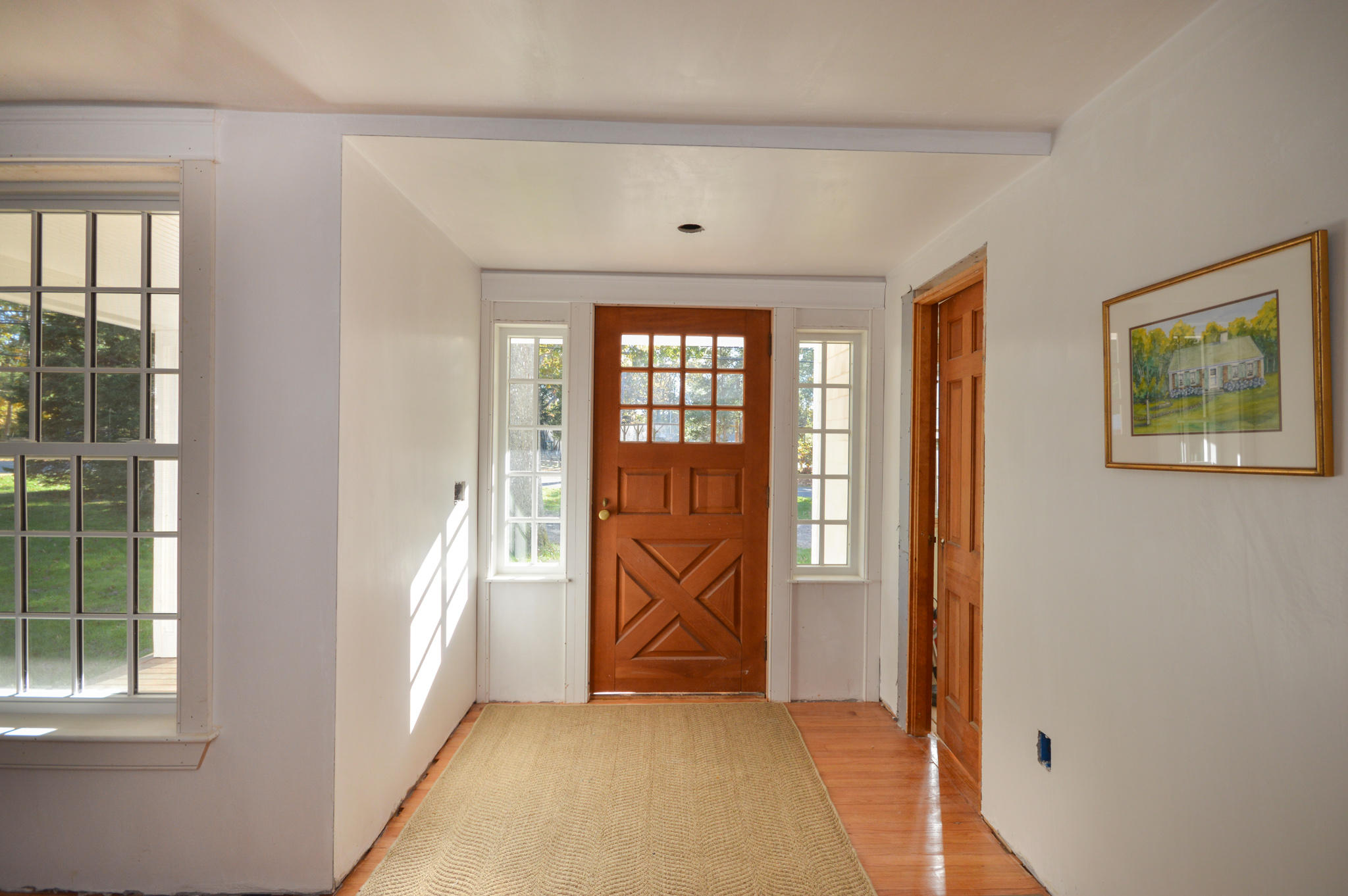 140 Scraggy Neck Road Cataumet, MA 02534 - Photo 10 of 39 wooden floor in a room next to a window