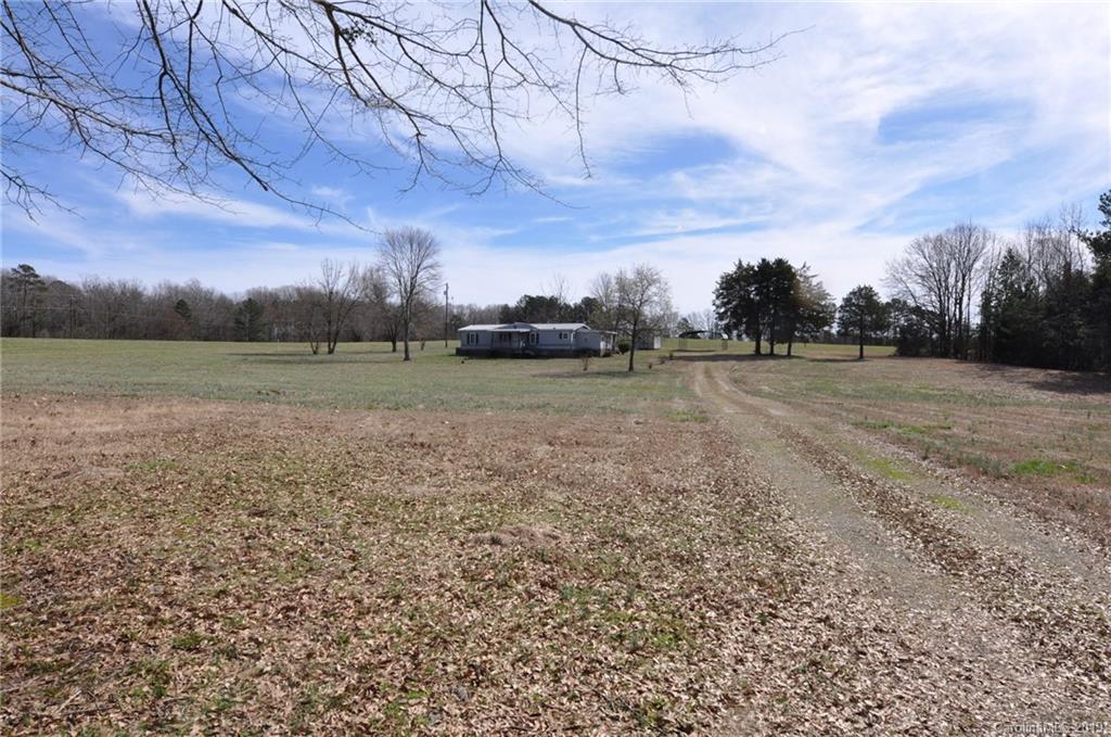 3088 Armenia Road Chester, SC 29706 - Photo 2 of 19 a view of dirt field with trees in background