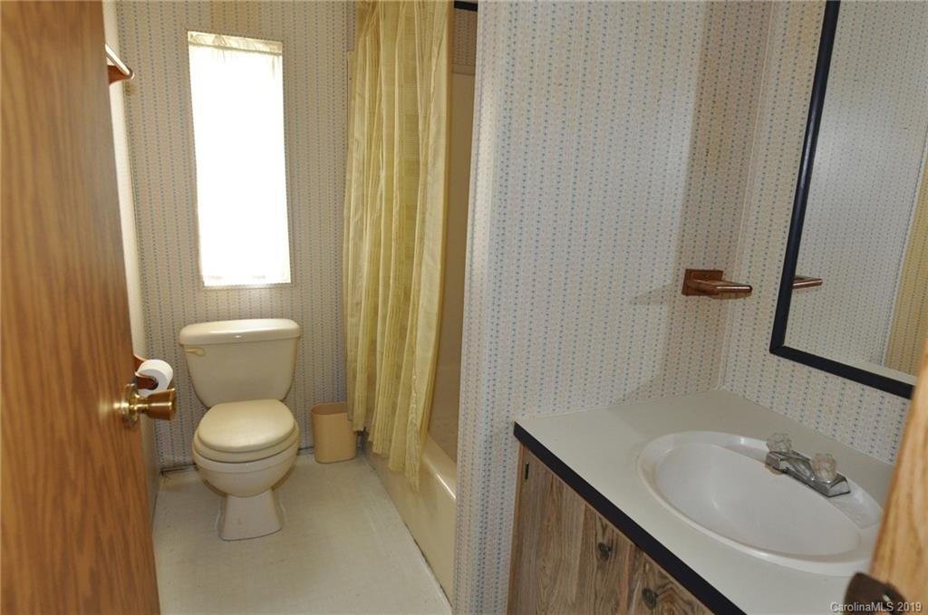 3088 Armenia Road Chester, SC 29706 - Photo 12 of 19 a bathroom with a toilet sink and mirror