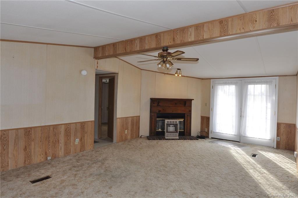 3088 Armenia Road Chester, SC 29706 - Photo 15 of 19 a view of an empty room with a fireplace and a window