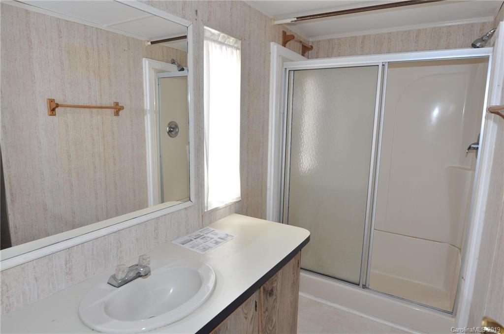 3088 Armenia Road Chester, SC 29706 - Photo 19 of 19 a bathroom with a sink and shower