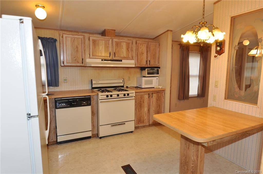 3088 Armenia Road Chester, SC 29706 - Photo 9 of 19 a kitchen with a stove a refrigerator and a sink