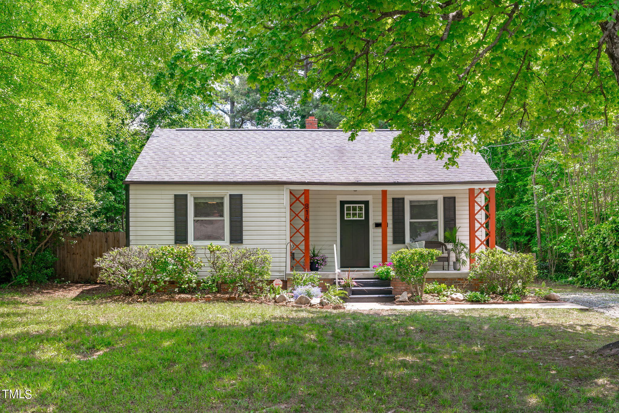 816 Colleton Road Raleigh, NC 27610 - Photo 1 of 49 a front view of a house with a yard and porch