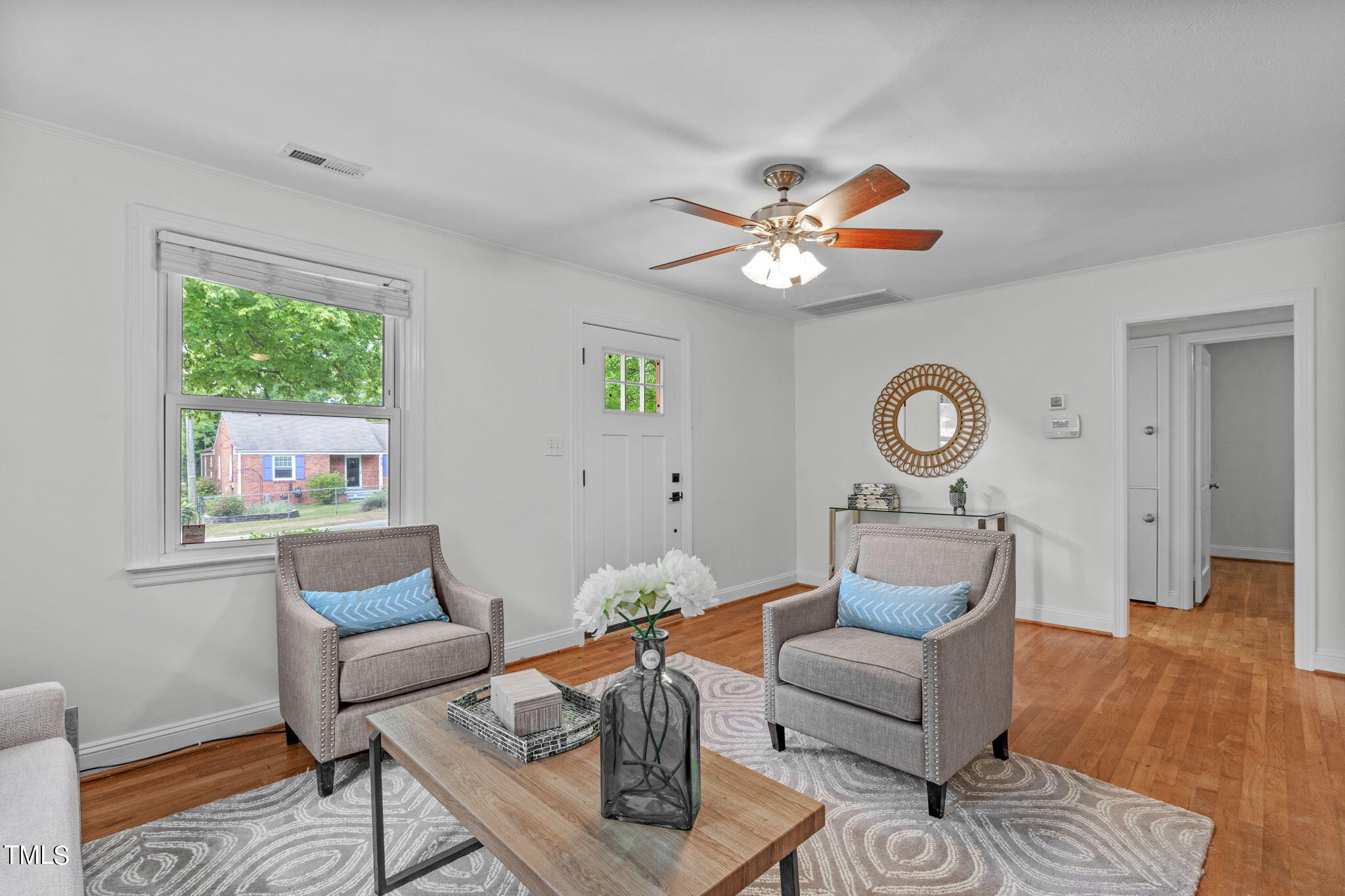 816 Colleton Road Raleigh, NC 27610 - Photo 13 of 49 a living room with furniture and a large window