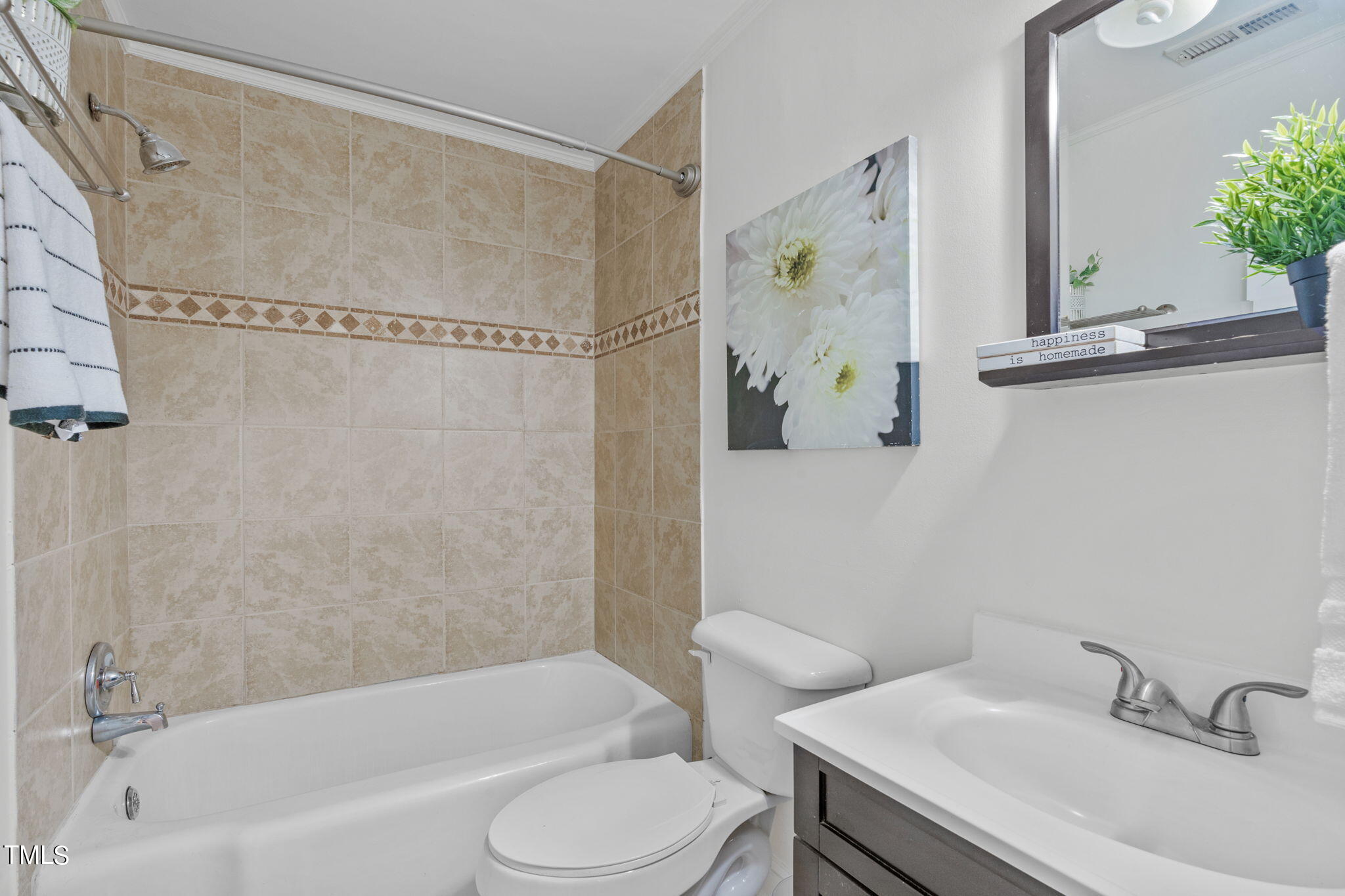 816 Colleton Road Raleigh, NC 27610 - Photo 30 of 49 a bathroom with a sink toilet and shower