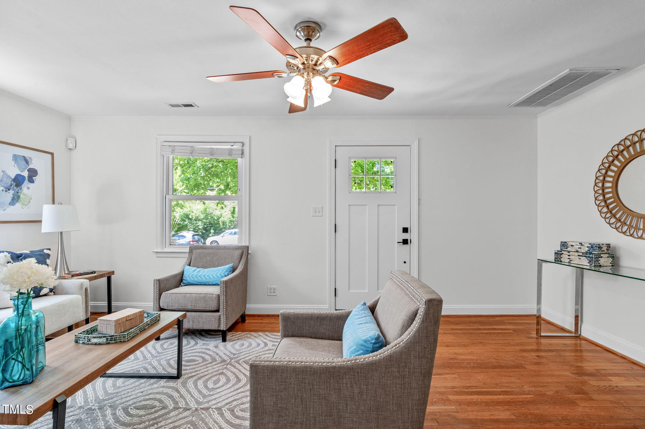 816 Colleton Road Raleigh, NC 27610 - Photo 8 of 49 a living room with furniture and a wooden floor