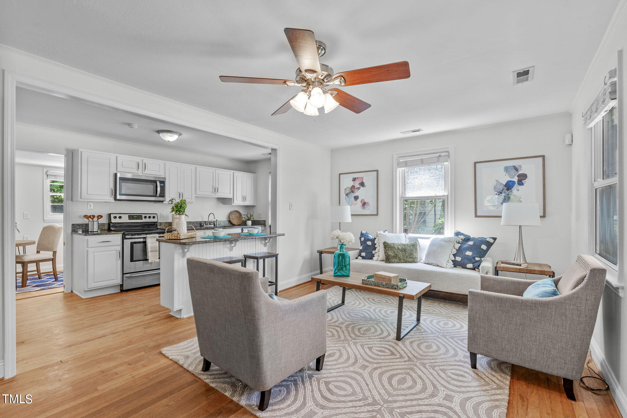 816 Colleton Road Raleigh, NC 27610 - Photo 10 of 49 a living room with furniture dining table a window and kitchen view