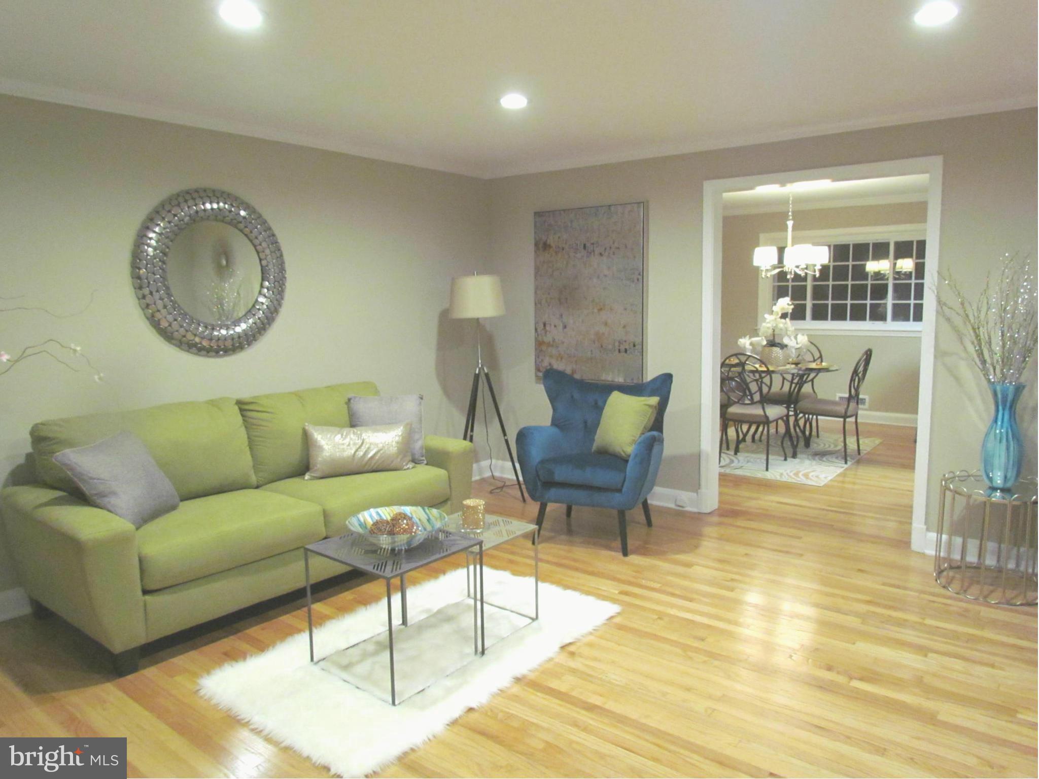1634 Ingram Road Baltimore, MD 21239 - Photo 2 of 21 a living room with furniture and a wooden floor