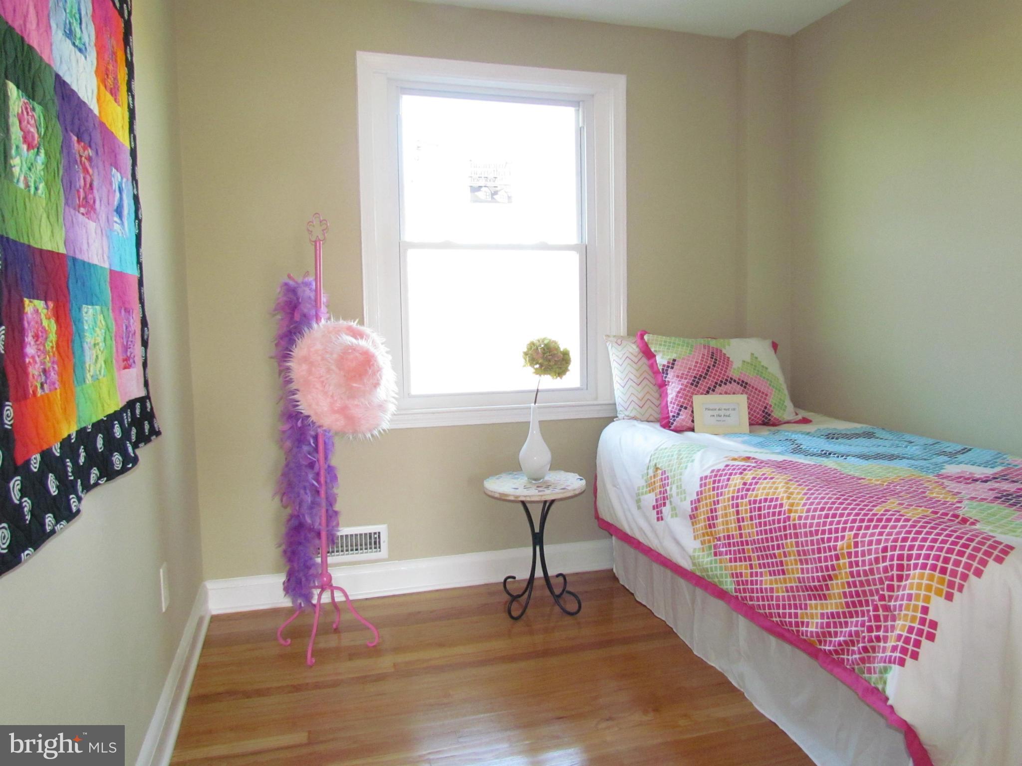 1634 Ingram Road Baltimore, MD 21239 - Photo 12 of 21 a bedroom with a bed and a window