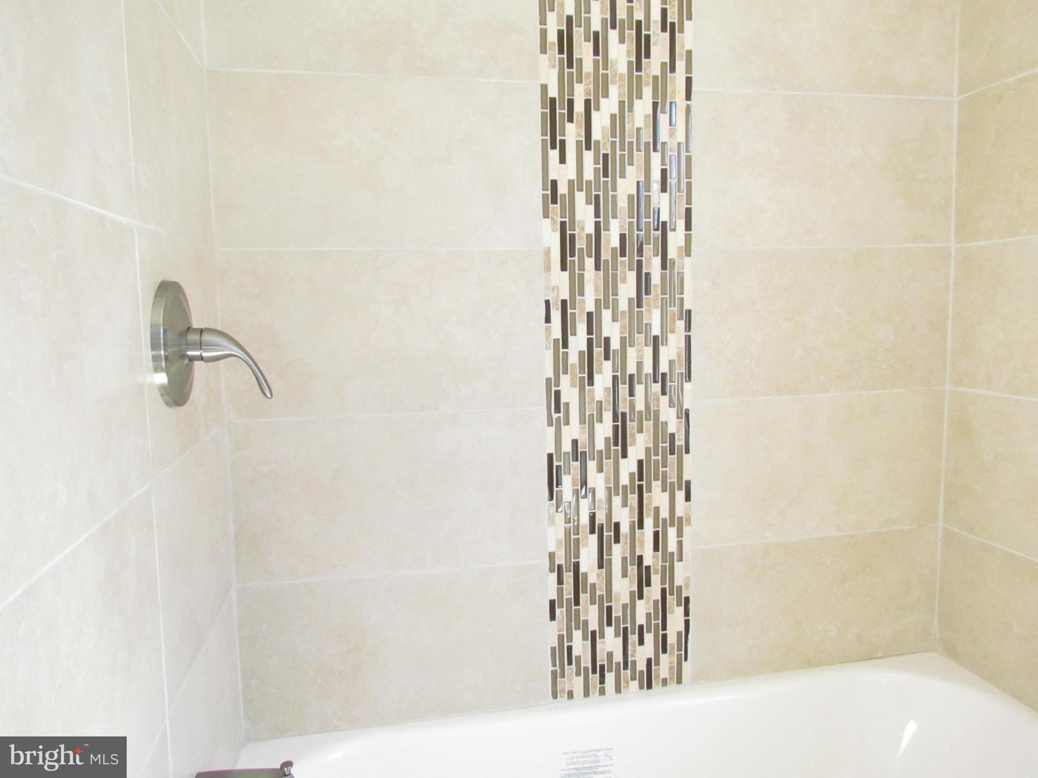 1634 Ingram Road Baltimore, MD 21239 - Photo 16 of 21 a bathroom with a shower curtain and a sink
