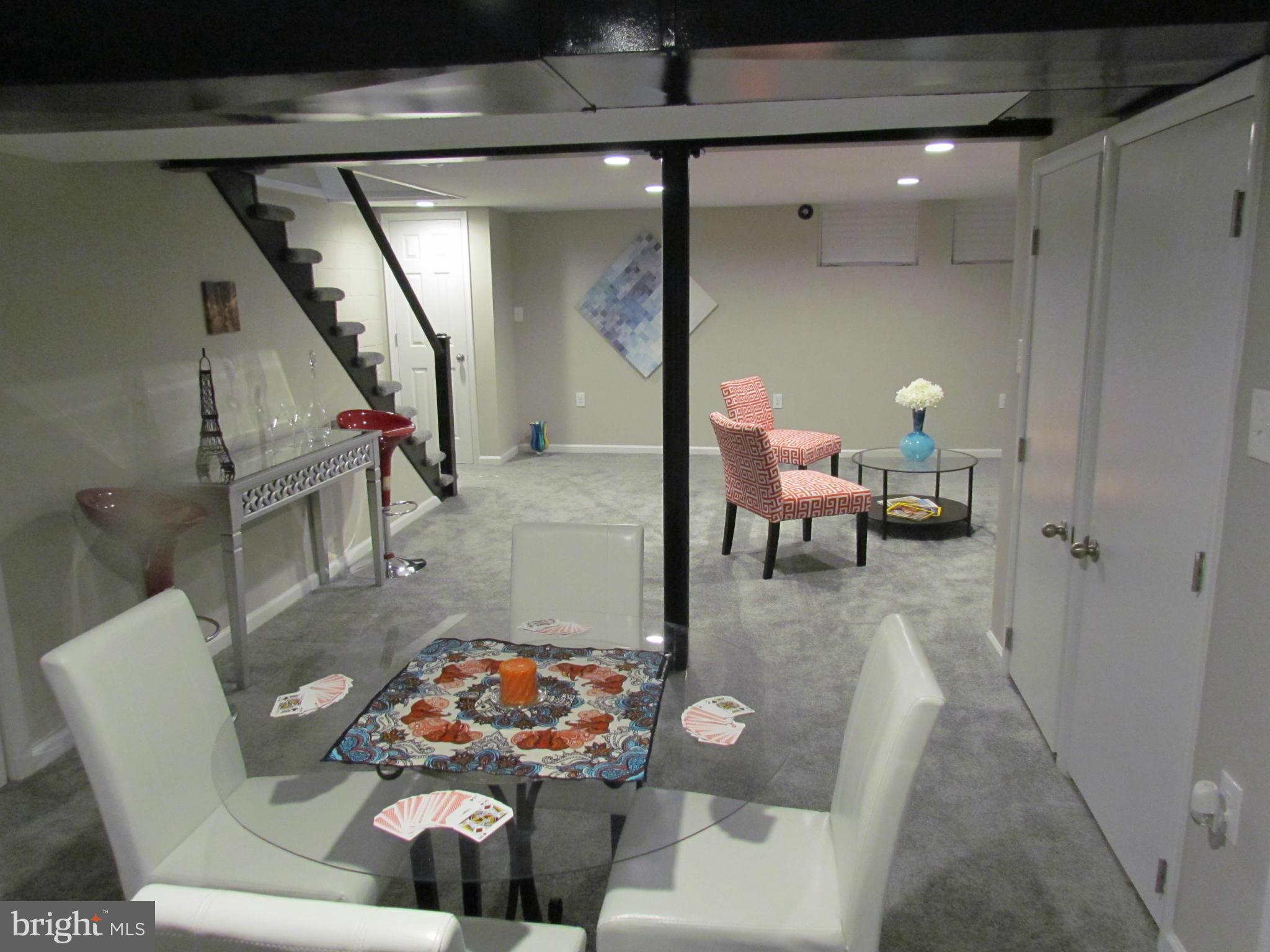 1634 Ingram Road Baltimore, MD 21239 - Photo 17 of 21 a living room with furniture and wooden floor