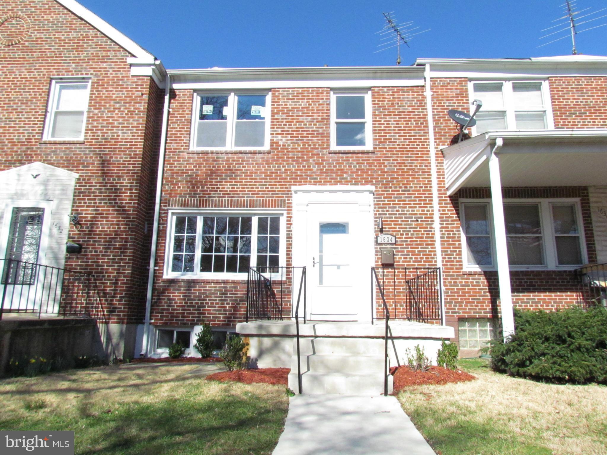 1634 Ingram Road Baltimore, MD 21239 - Photo 21 of 21 a brick house that has a lots of windows in it