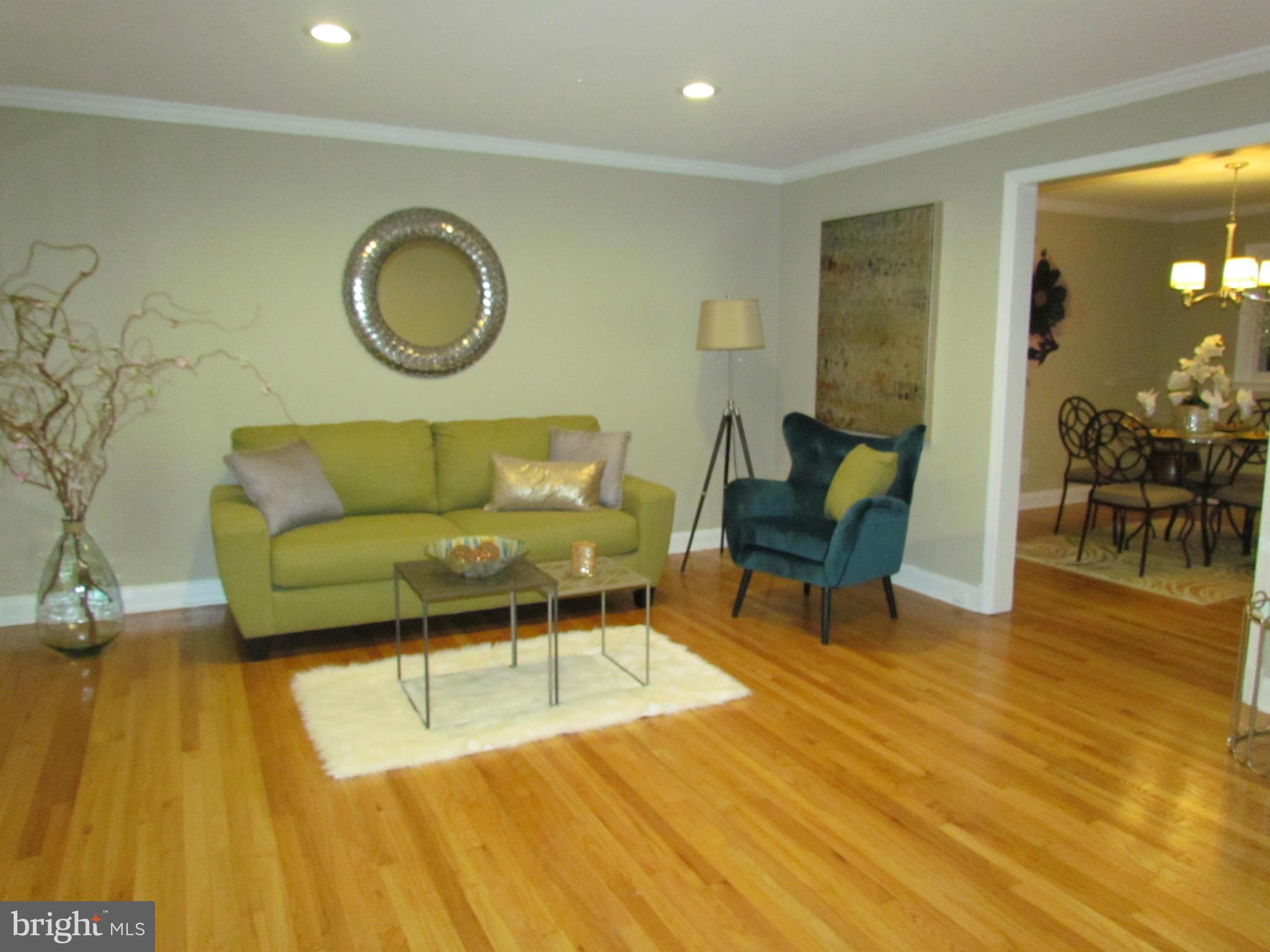 1634 Ingram Road Baltimore, MD 21239 - Photo 4 of 21 a living room with furniture and a wooden floor