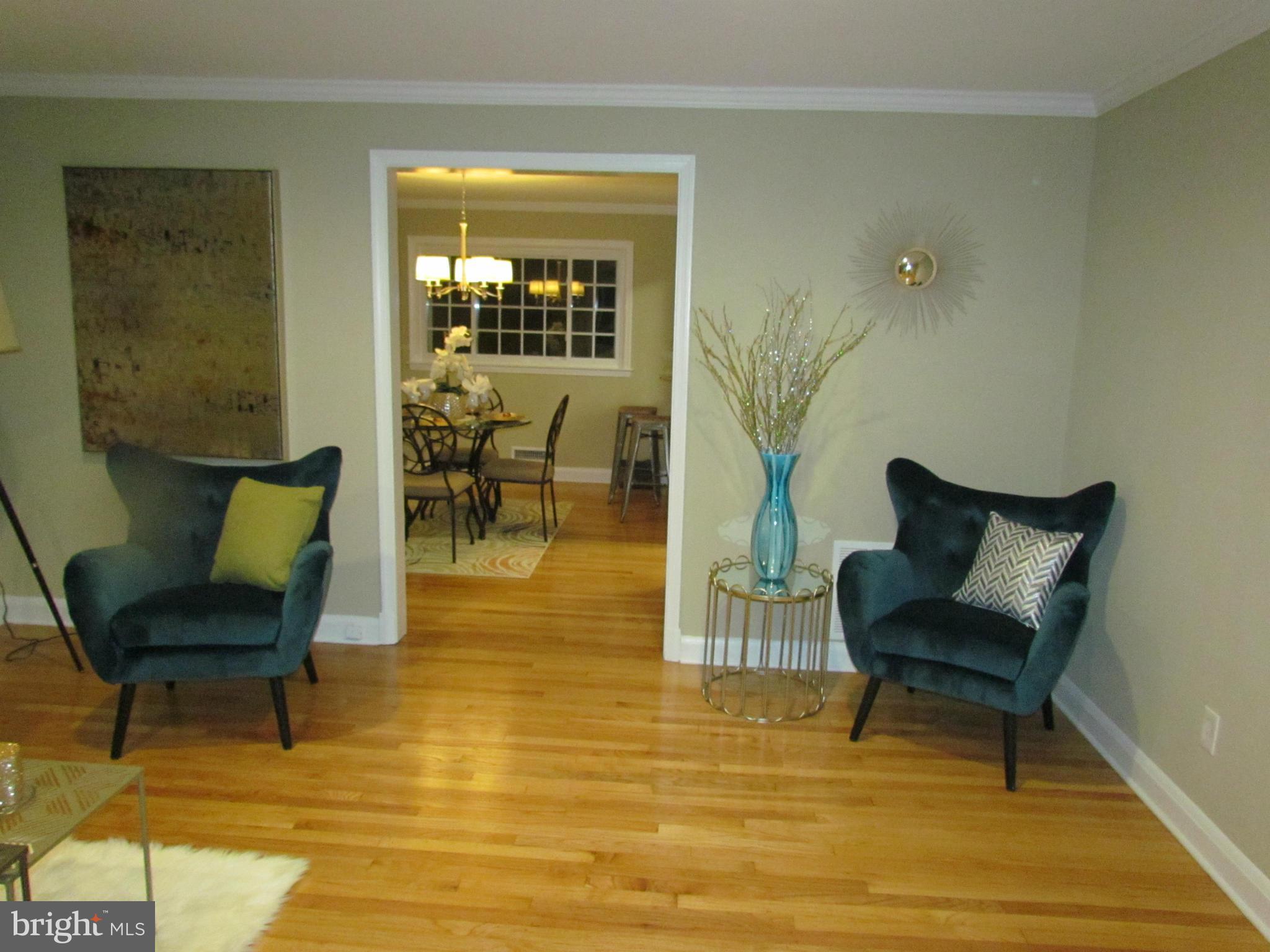 1634 Ingram Road Baltimore, MD 21239 - Photo 5 of 21 a living room with furniture and a chair