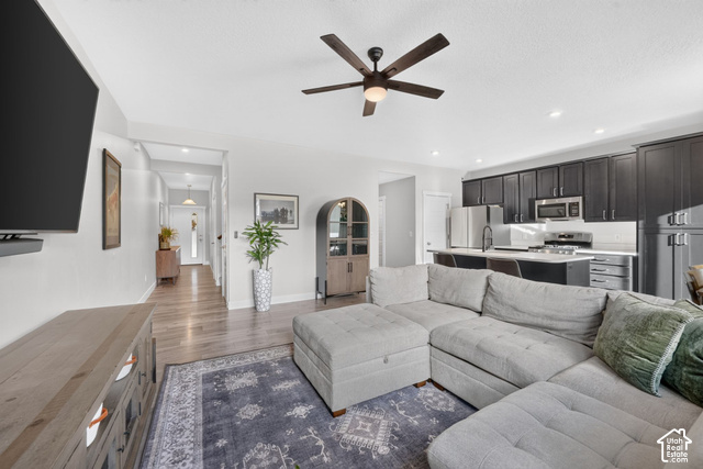 1081 Bowery Way Mapleton, UT 84664 - Photo 4 of 41 Open-concept living area with wood-finish flooring, recessed lighting, and a ceiling fan