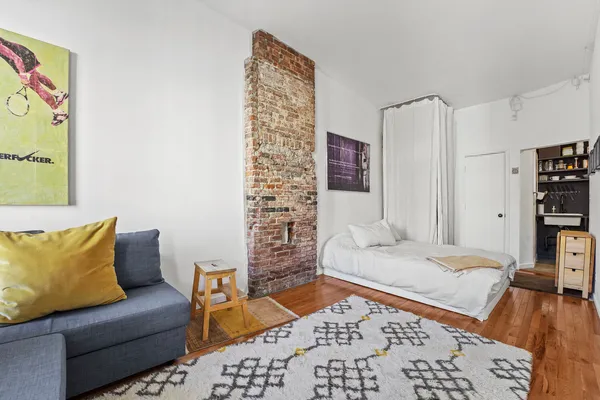 a bedroom with furniture and a bed