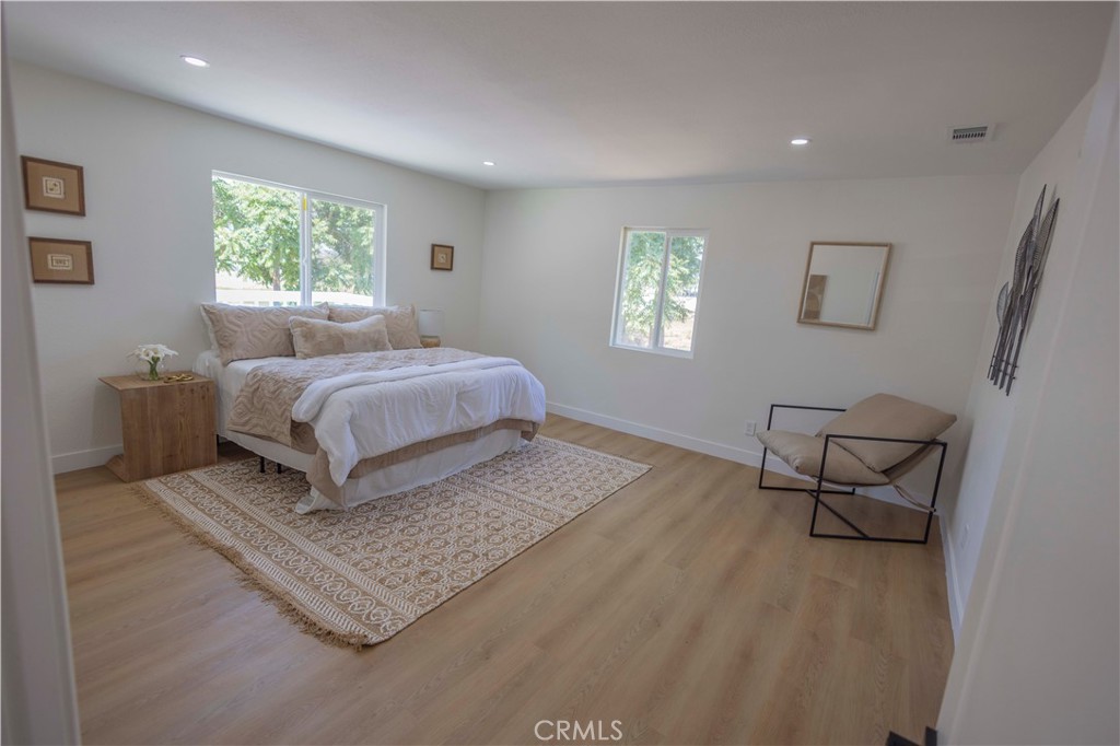 20530 Clark Street Perris, CA 92570 - Photo 14 of 25 a living room with a bed furniture and a window